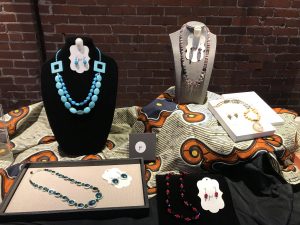 Five necklace and earring sets at Lyric Theatre.